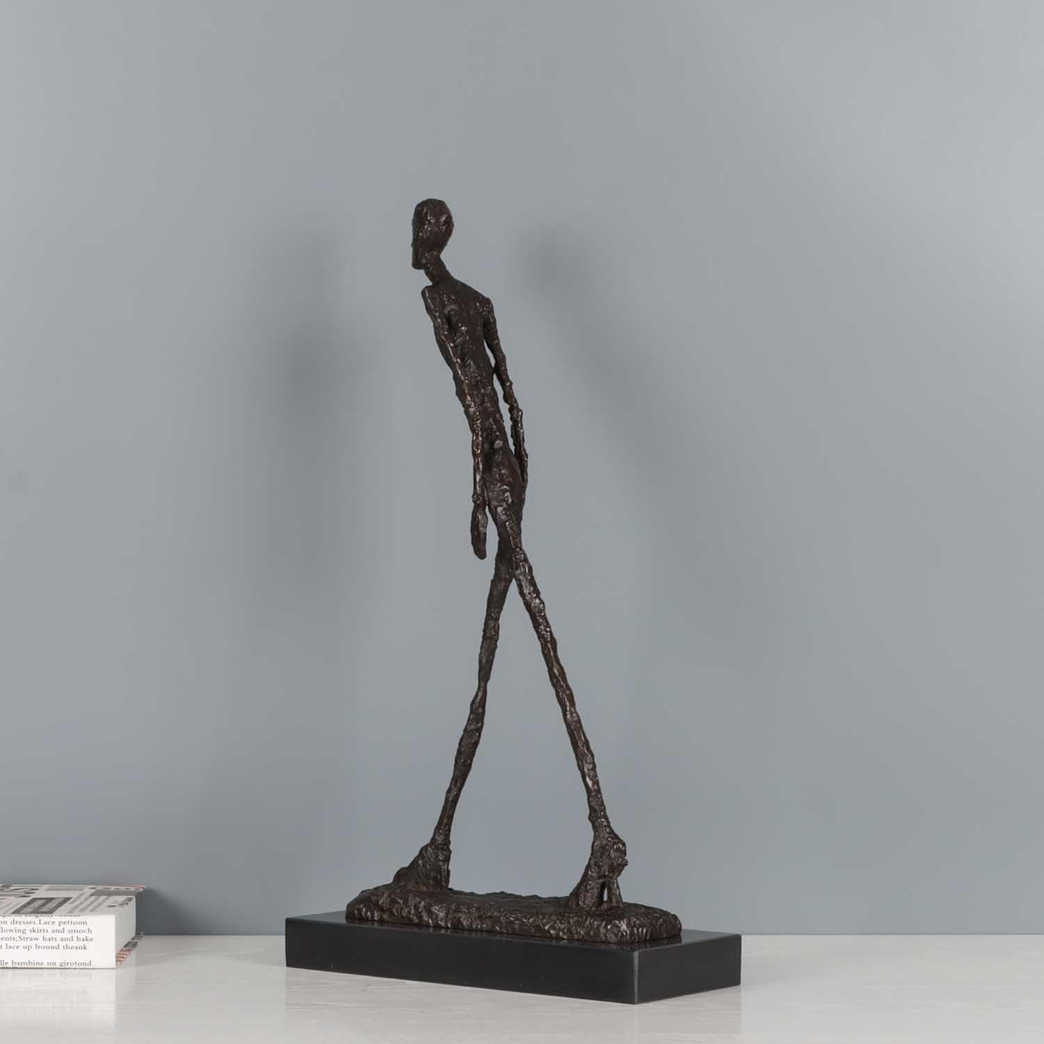 MonsterArt bronze walking man sculpture